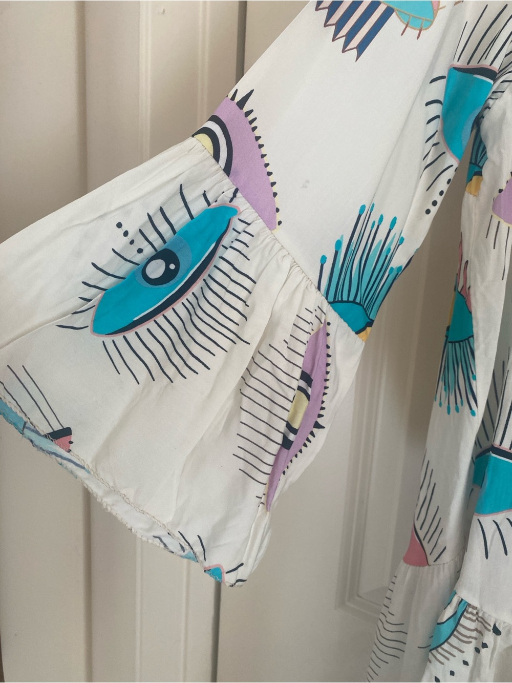NT by Amati Eye Print Tiered Tunic Dress - White with Teal, Pink & Purple Eyes - Picture 4 of 5